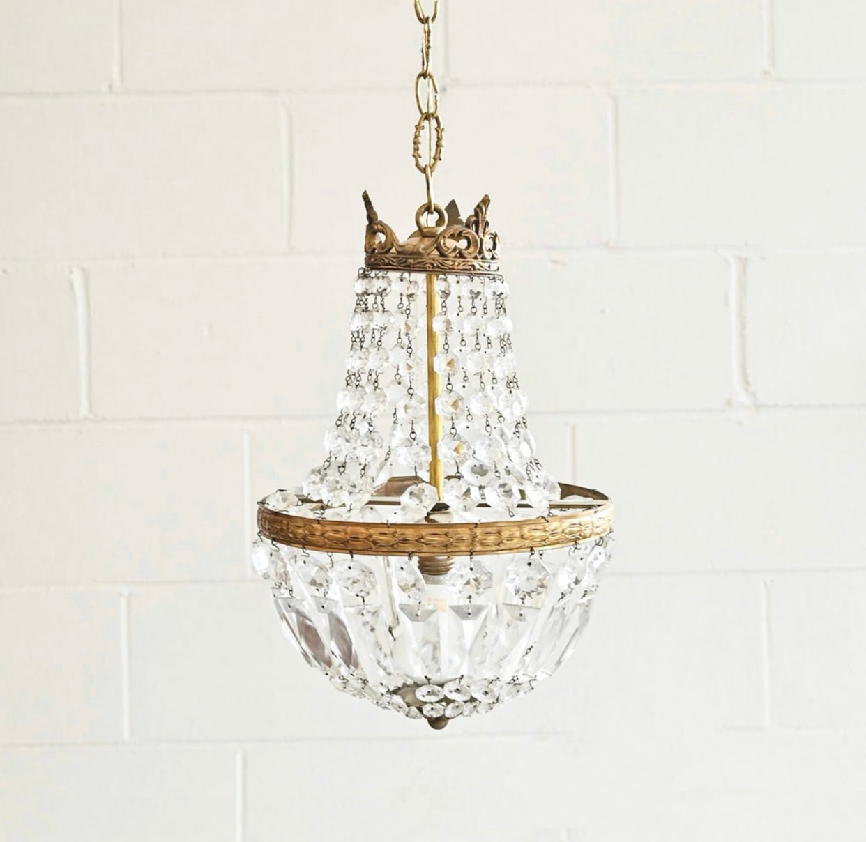 Vintage lamps, antique candlesticks, and unique lighting accents from brocantes and markets.