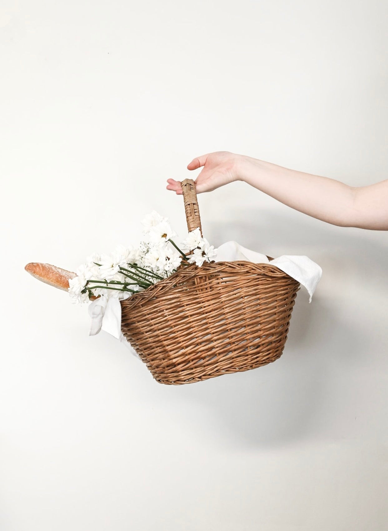 Handwoven storage baskets and paniers with rustic charm, sourced from markets and brocantes.