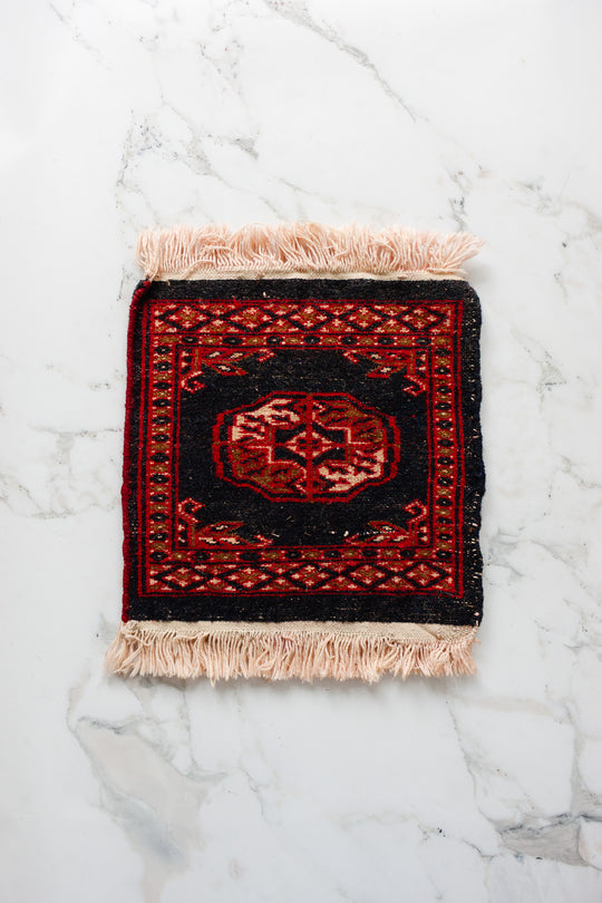 vintage Persian placemat sized rug, navy and red