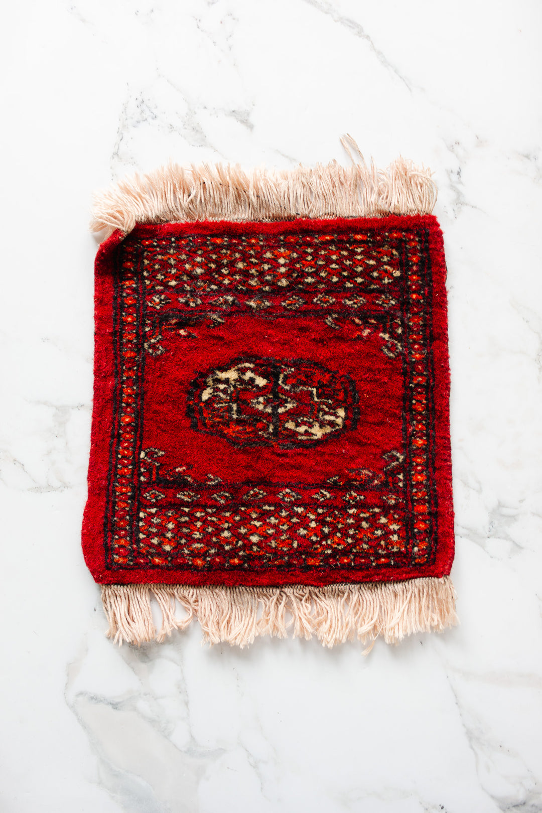 vintage Persian placemat sized rug, red