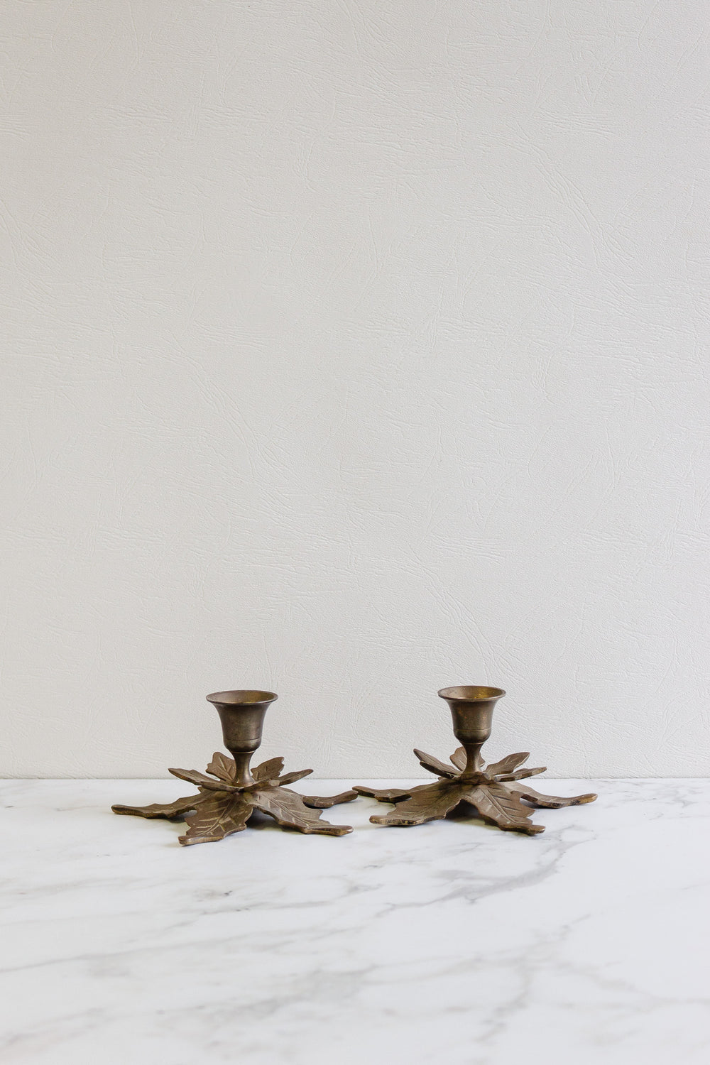 pair of antique french brass leaf candlesticks
