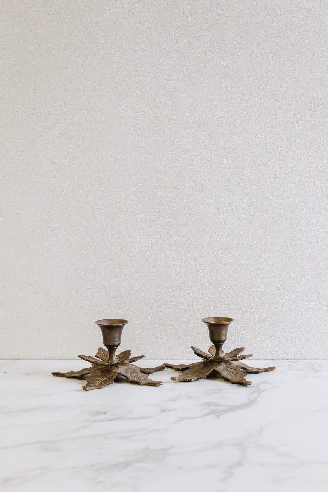 pair of antique french brass leaf candlesticks