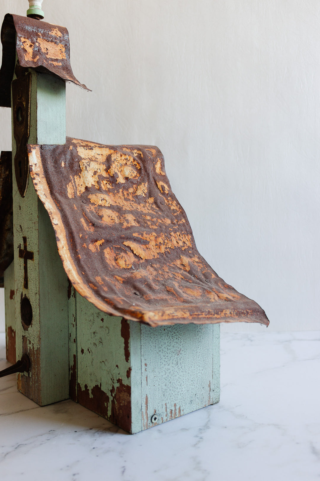 antique European wooden bird house with tin roof