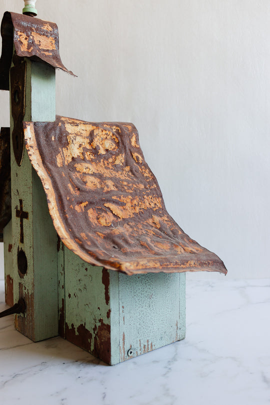 antique European wooden bird house with tin roof