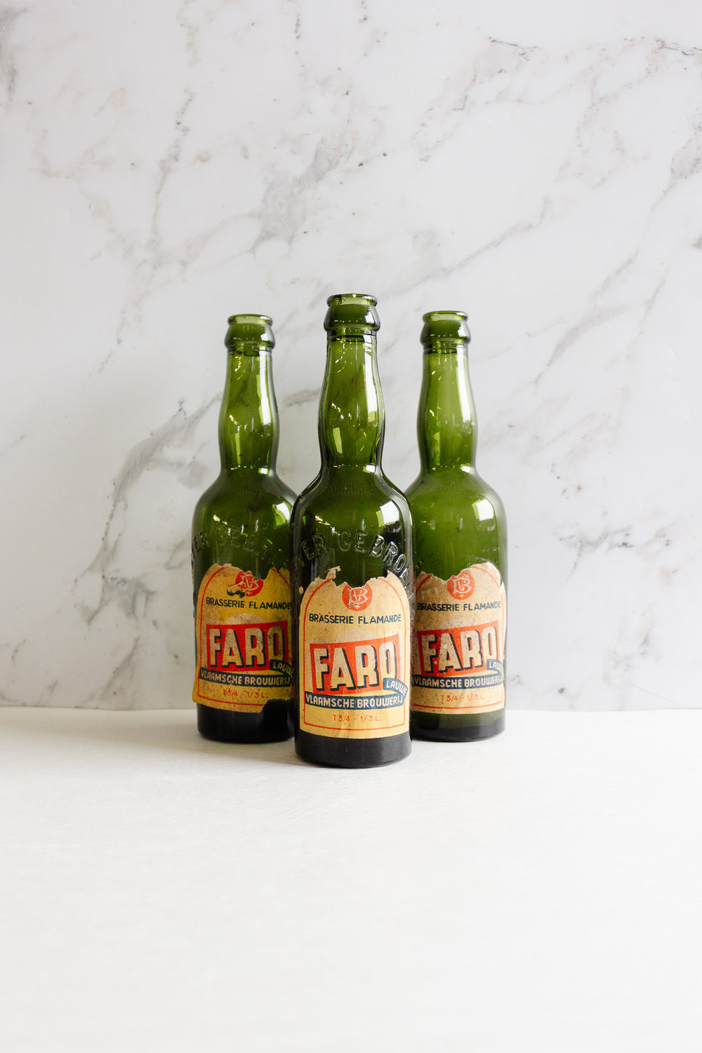 vintage Belgian "faro" embossed glass beer bottle