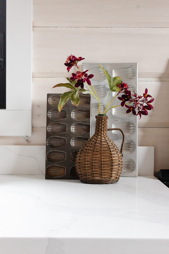 vintage French wicker wrapped demijohn