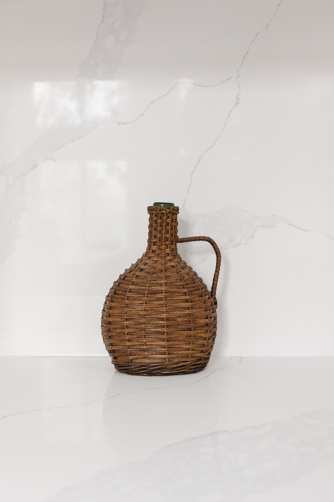 vintage French wicker wrapped demijohn
