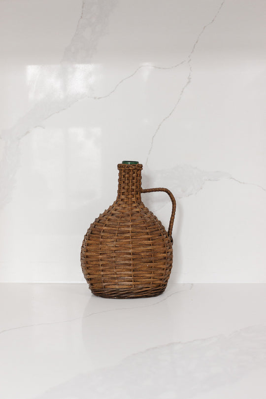 vintage French wicker wrapped demijohn