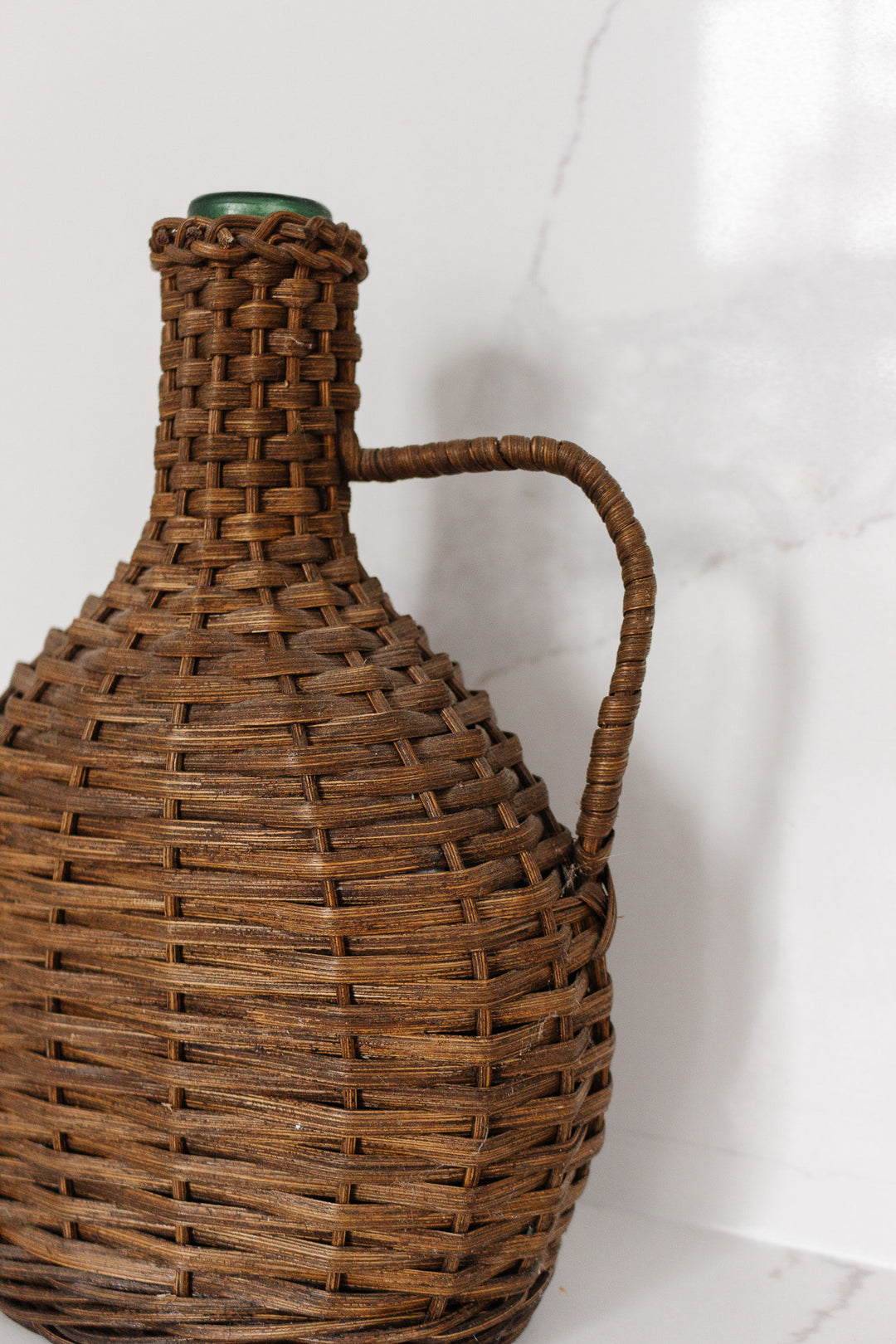 vintage French wicker wrapped demijohn
