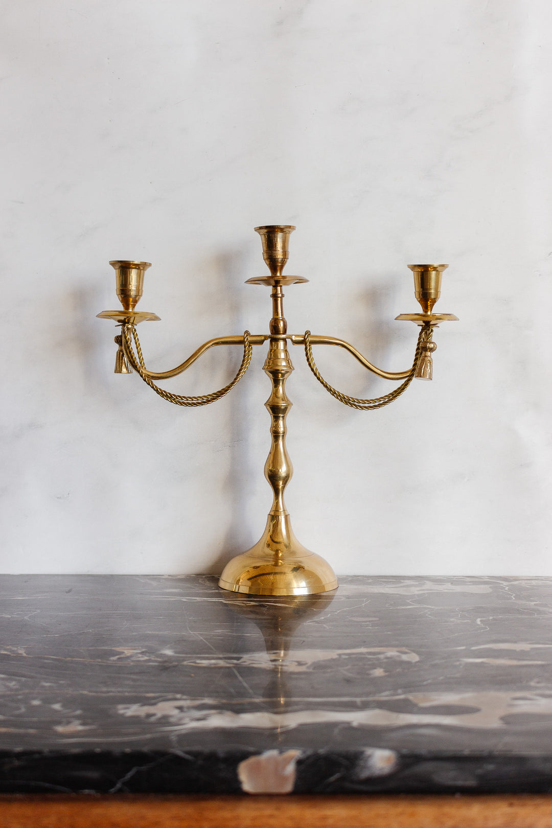 pair of vintage french candelabras with brass rope and tassels