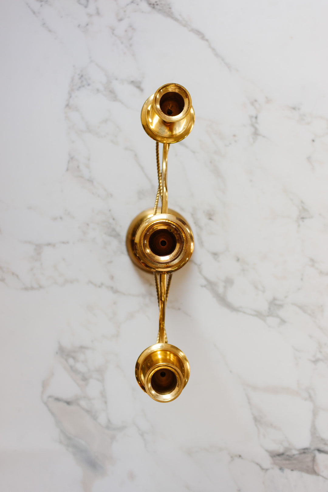 pair of vintage french candelabras with brass rope and tassels