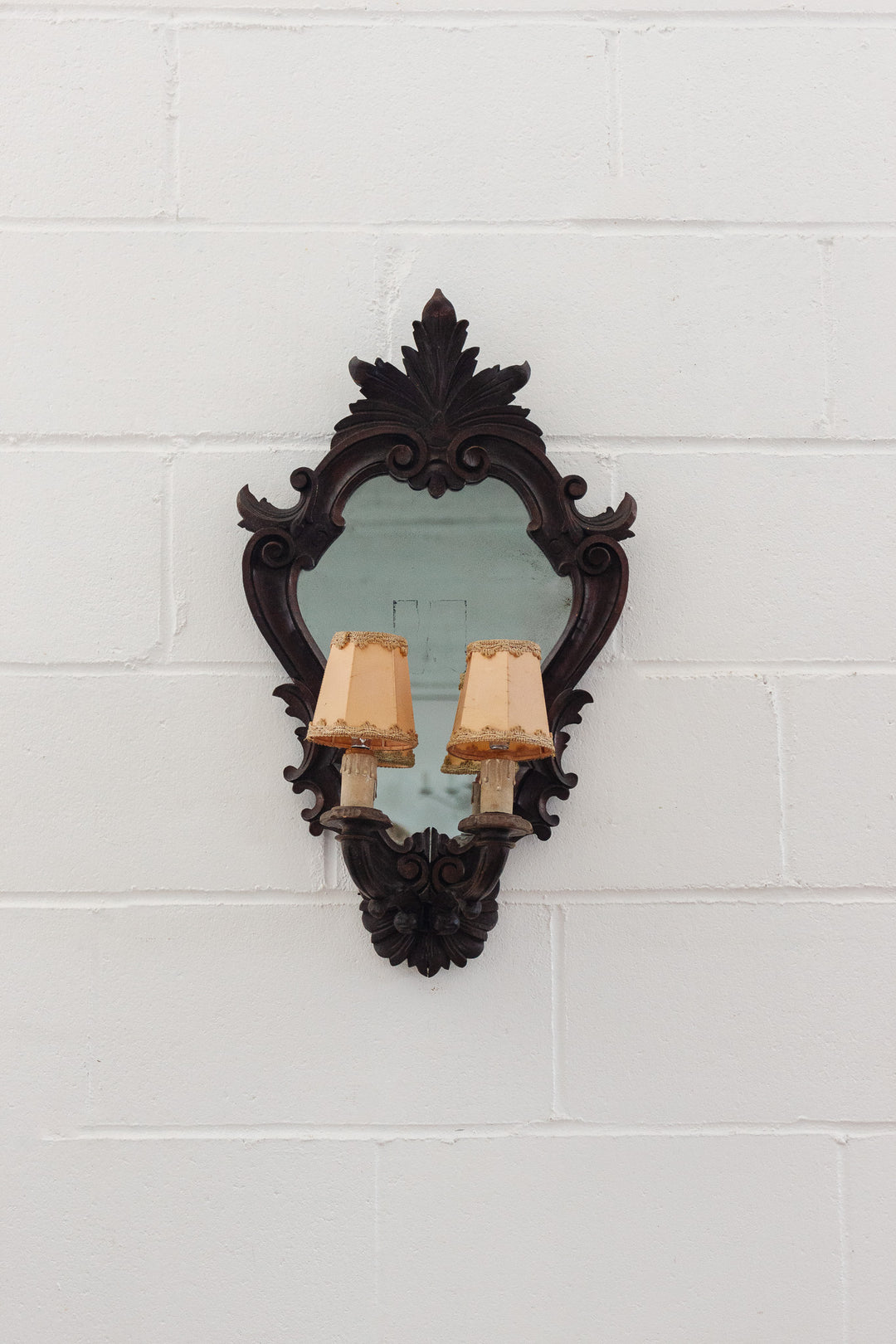 1920s French carved wood rococo style mirror sconce