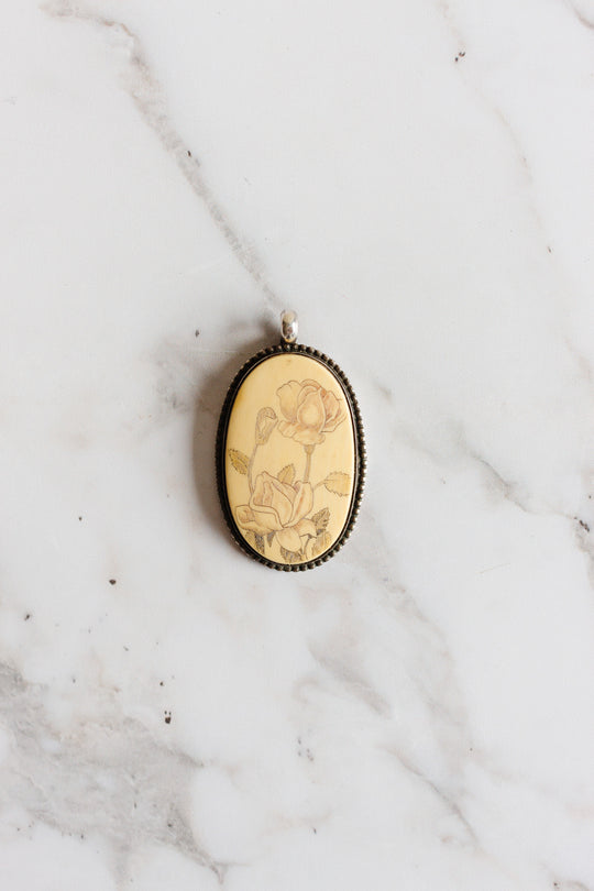 stamped English antique sterling silver and scrimshaw pendant