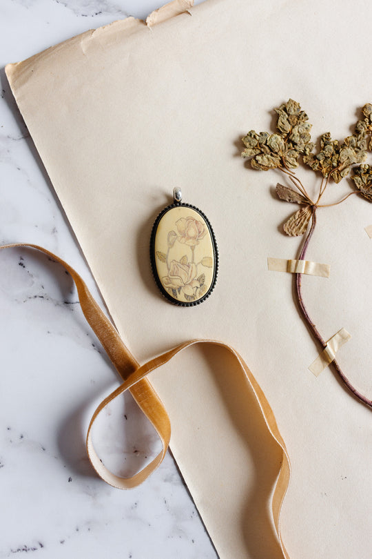 stamped English antique sterling silver and scrimshaw pendant