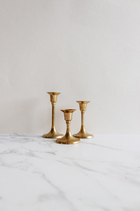 trio of graduated vintage french brass candlesticks