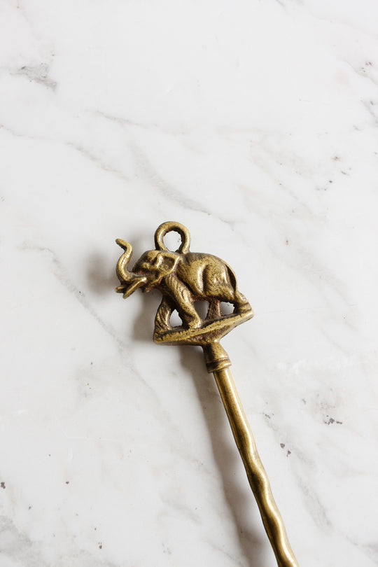 antique brass shoe horn: elephant or horse
