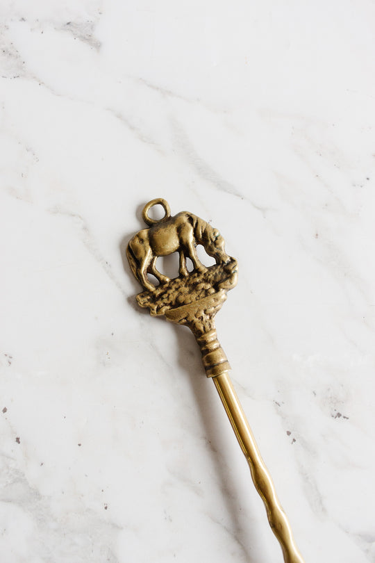 antique brass shoe horn: elephant or horse