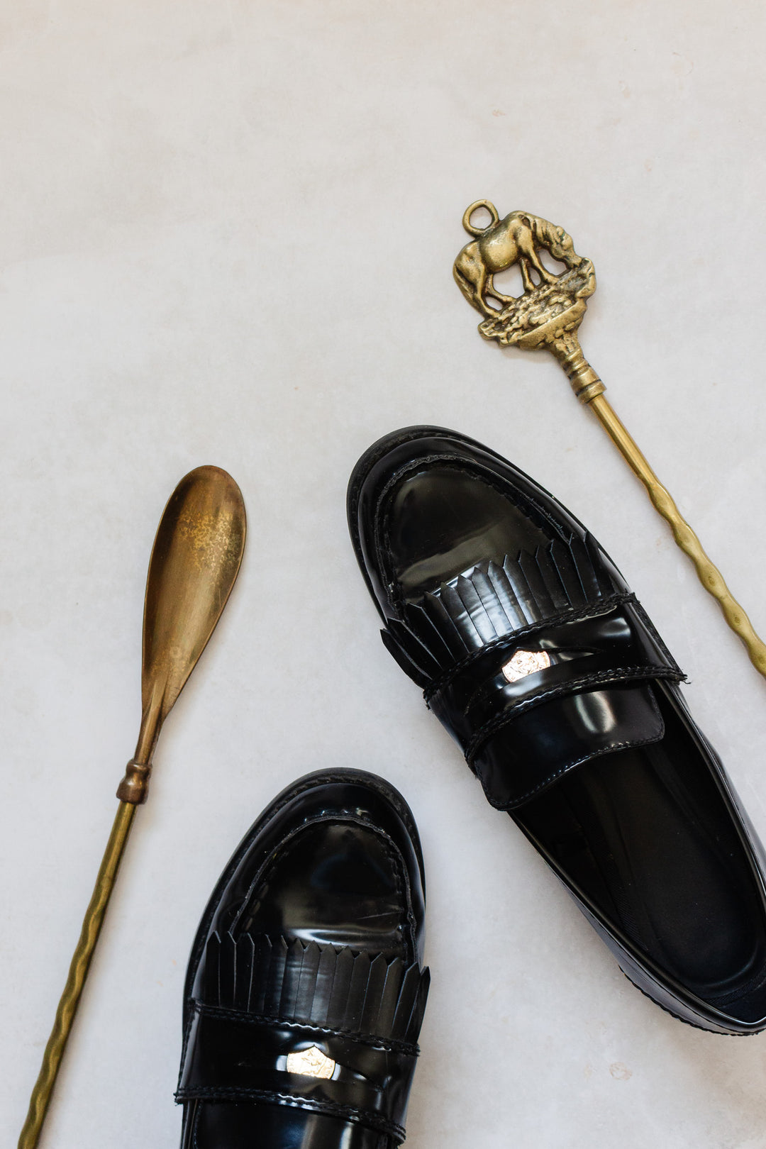 antique brass shoe horn: elephant or horse