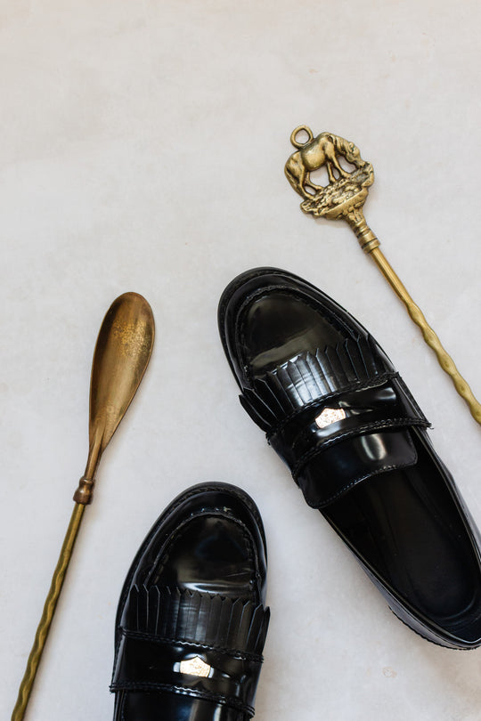 antique brass shoe horn: elephant or horse