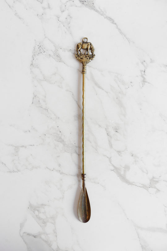 antique brass shoe horn: elephant or horse