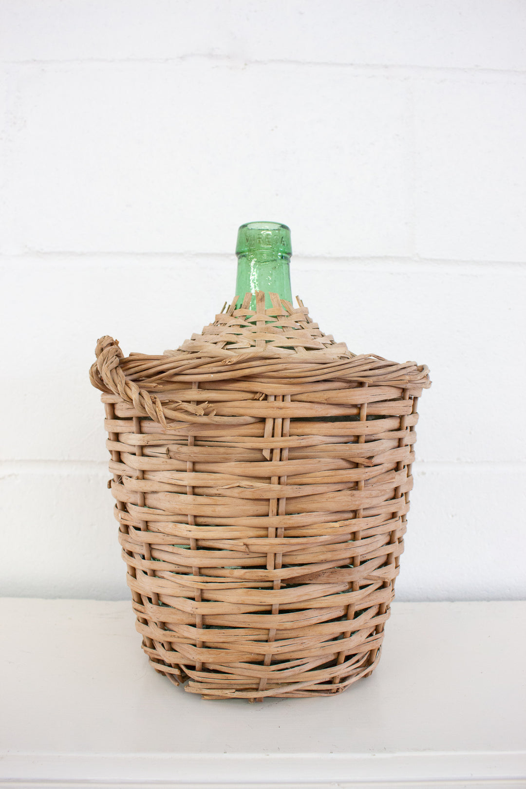 vintage french wicker wrapped demijohn