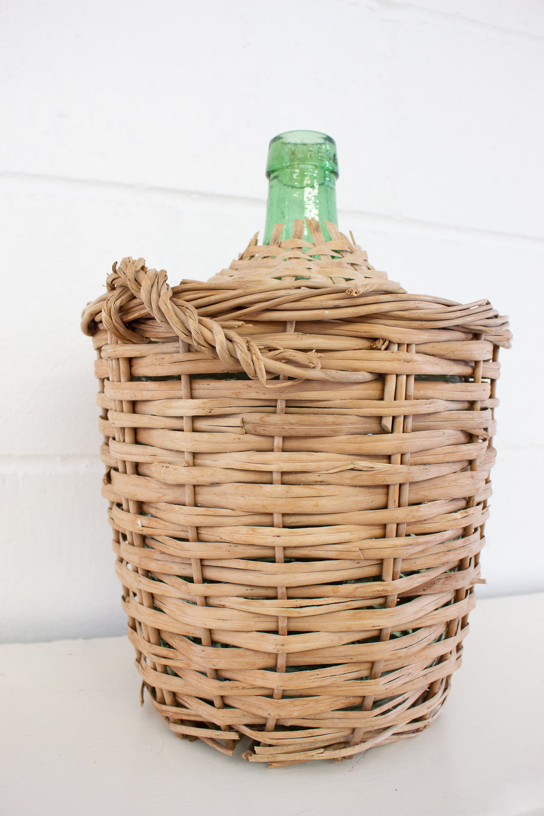 vintage french wicker wrapped demijohn
