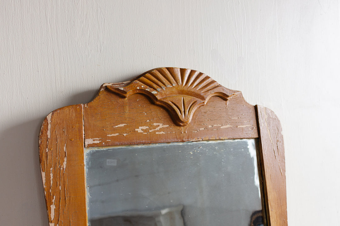 antique carved wood mirror with wavy glass