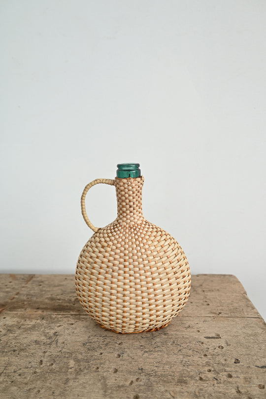 vintage woven handled demijohn