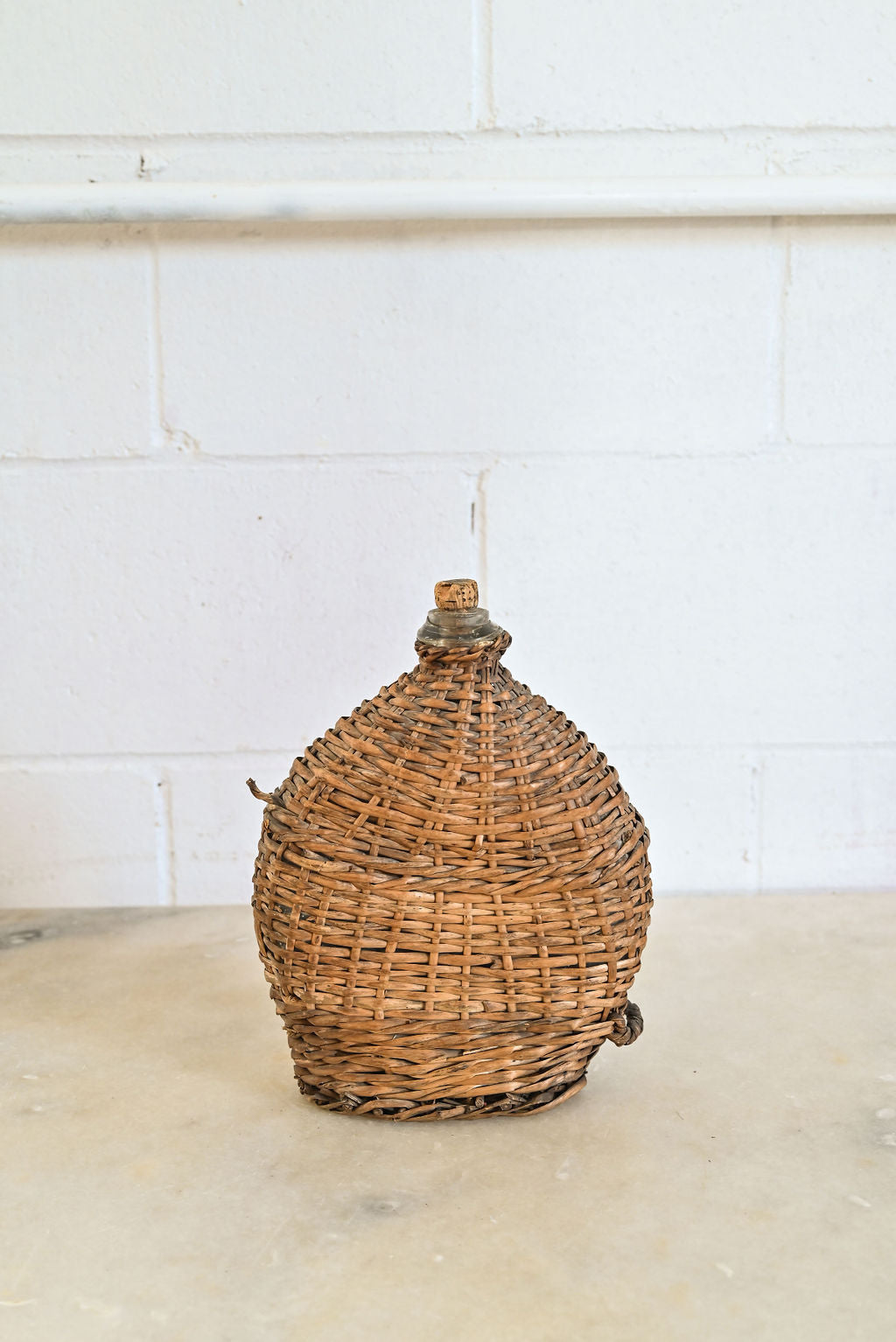 vintage french wicker wrapped demijohn