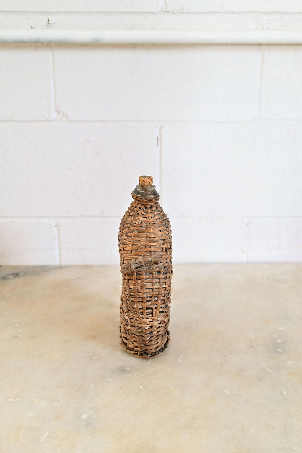 vintage french wicker wrapped demijohn