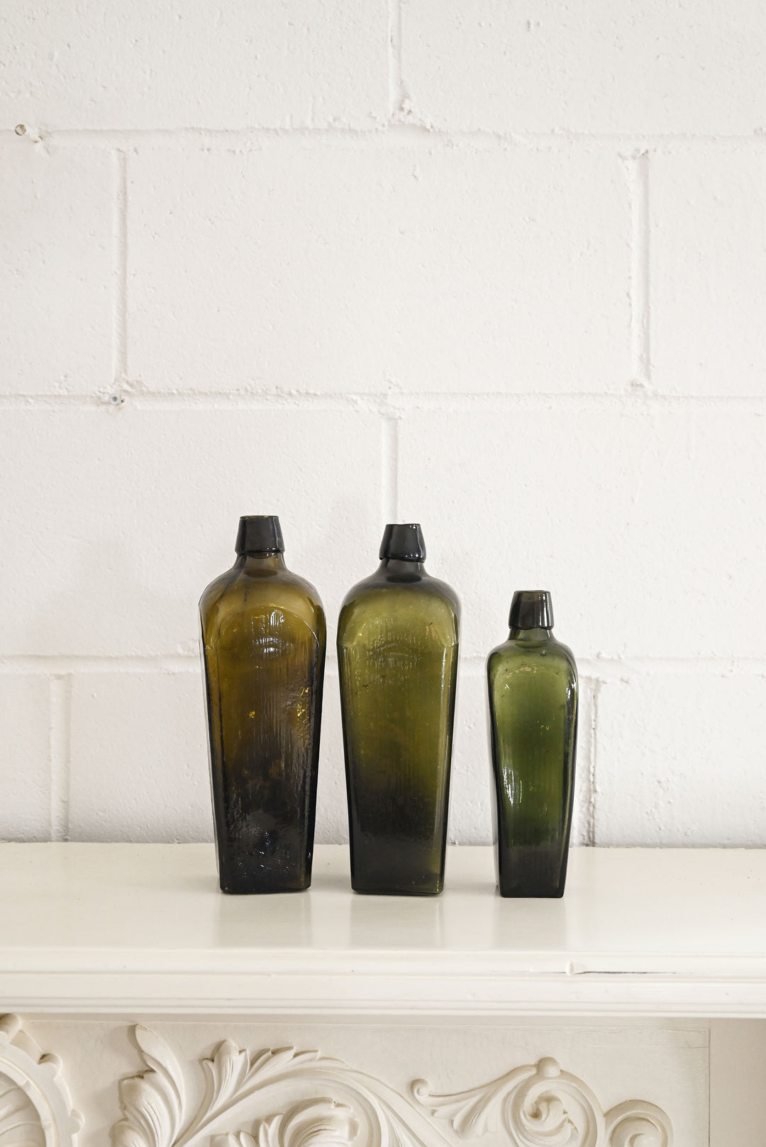 vintage green glass gin bottles