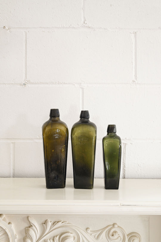 vintage green glass gin bottles