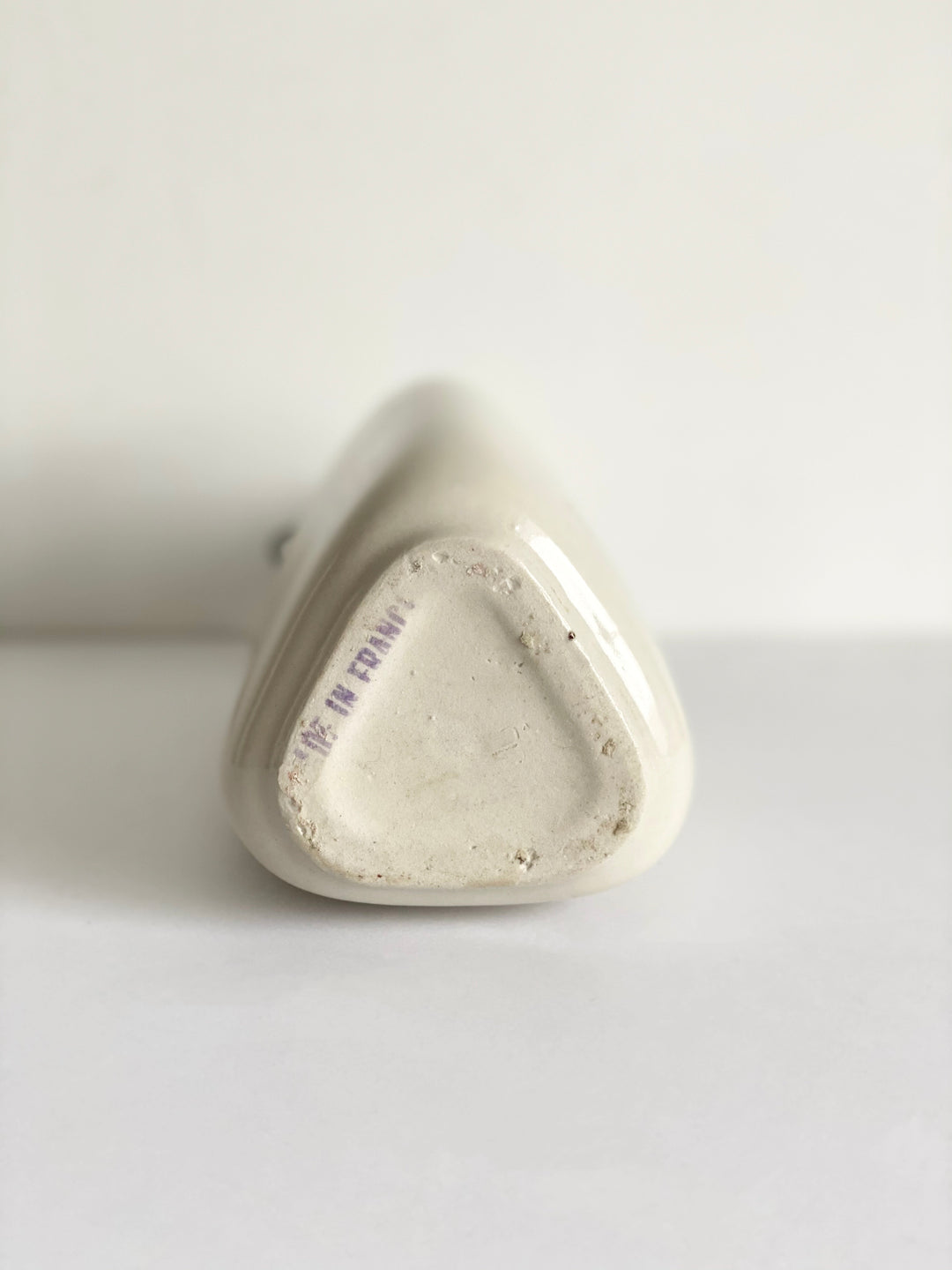 vintage French stoneware bottle, triangular with porcelain lid