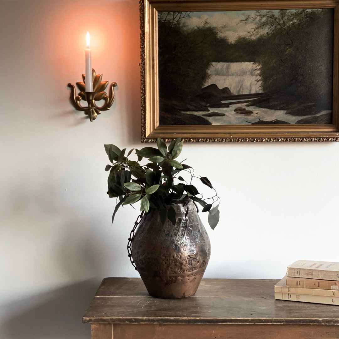 vintage hand forged metal vessel