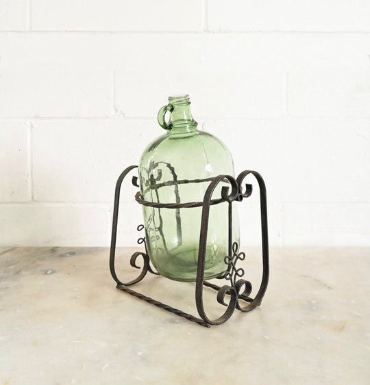 1970s french demijohn with wrought iron stand
