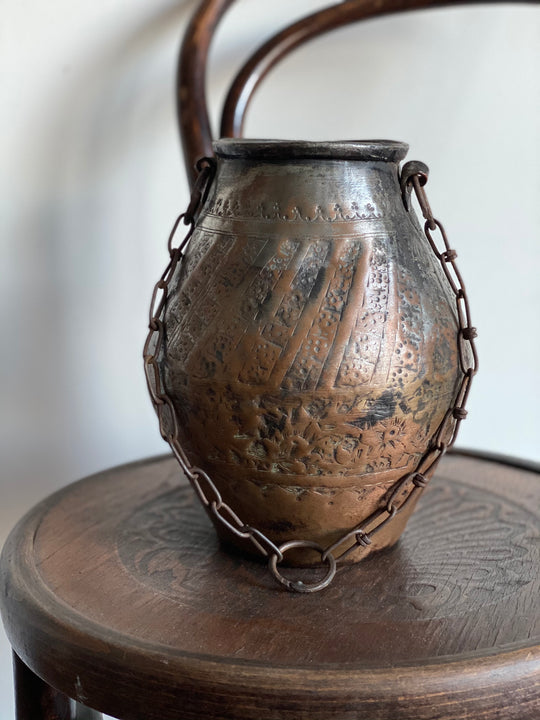 vintage hand forged metal vessel
