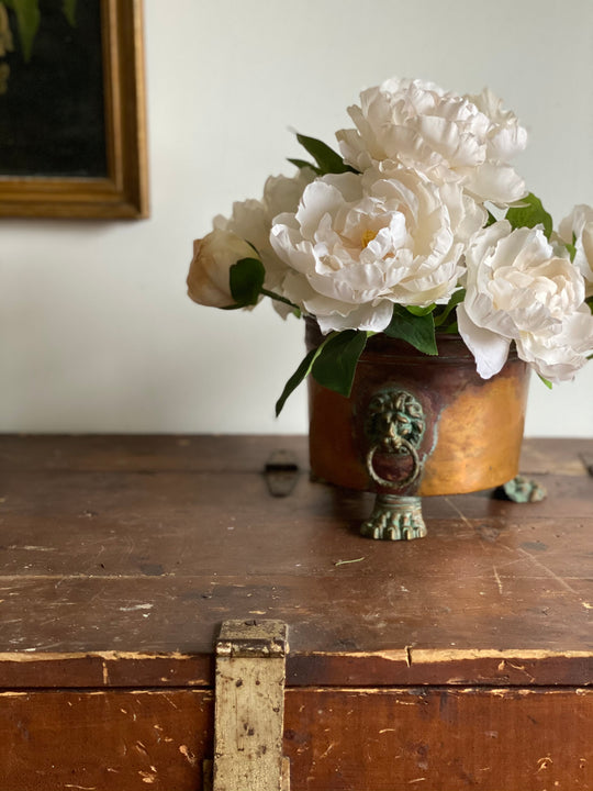 antique copper lion’s head footed planter