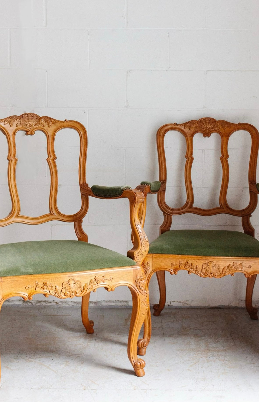 pair of 1950s Belgian Liégeoise rococo style carved oak armchairs