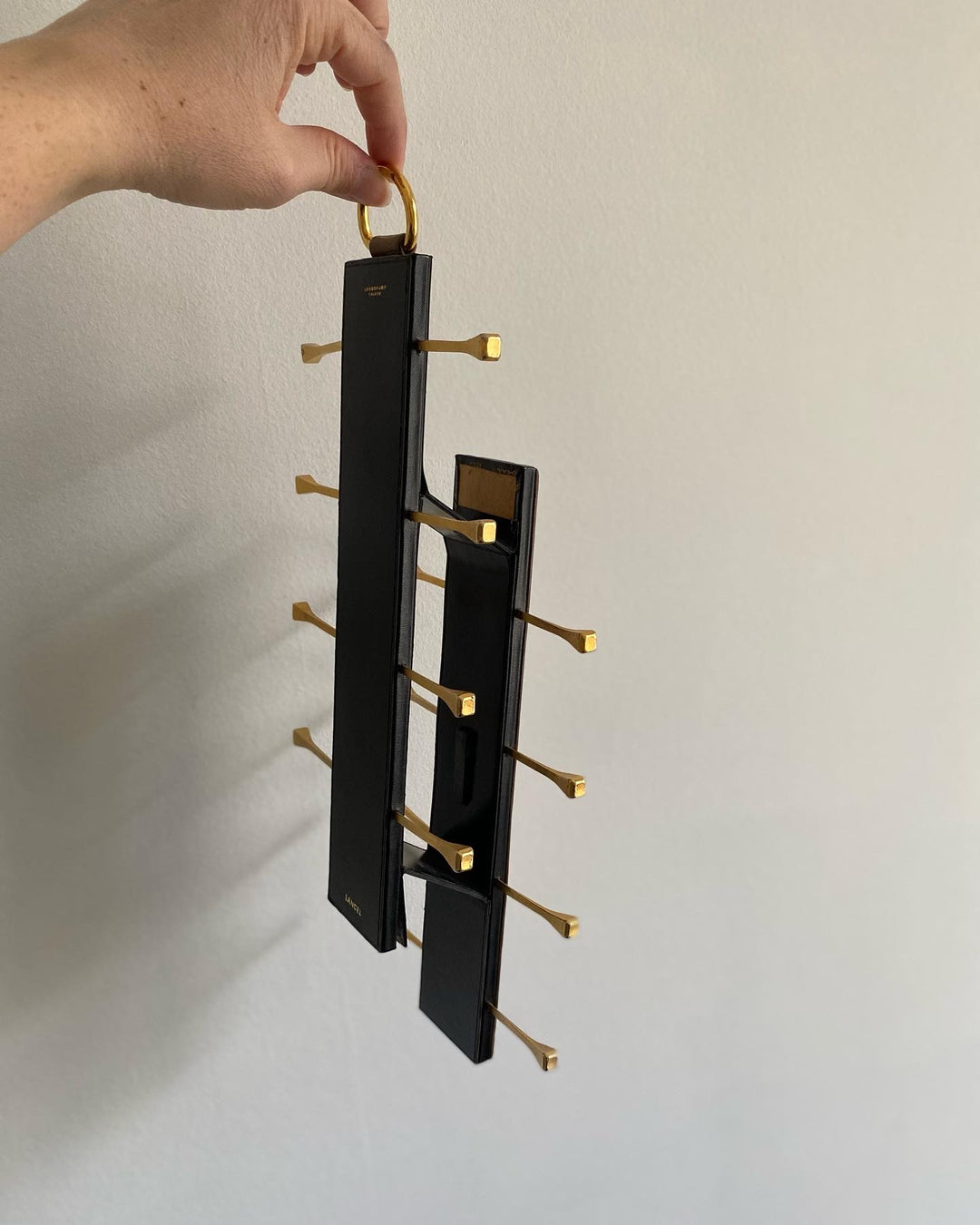 midcentury french brass and leather Longchamp tie rack by Jacques Adnet