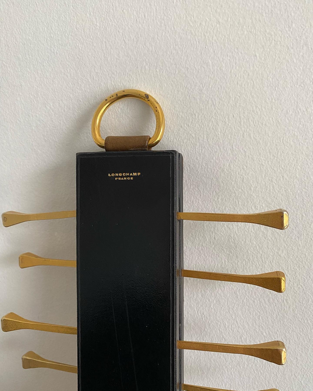 midcentury french brass and leather Longchamp tie rack by Jacques Adnet