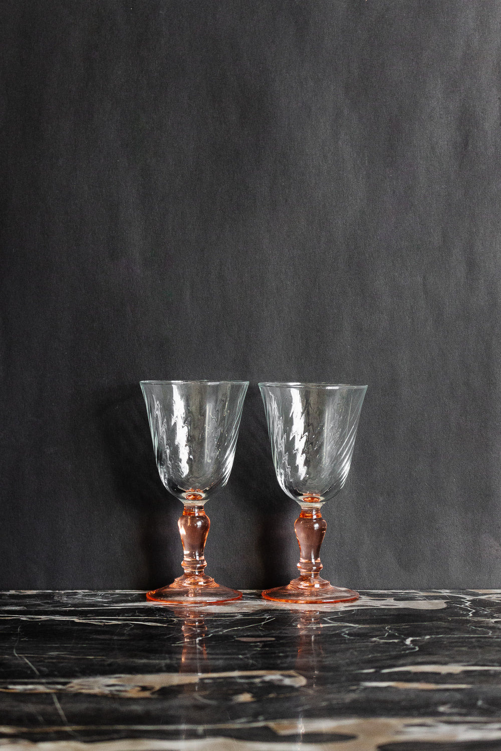 pair of vintage French rosaline stem wine glasses