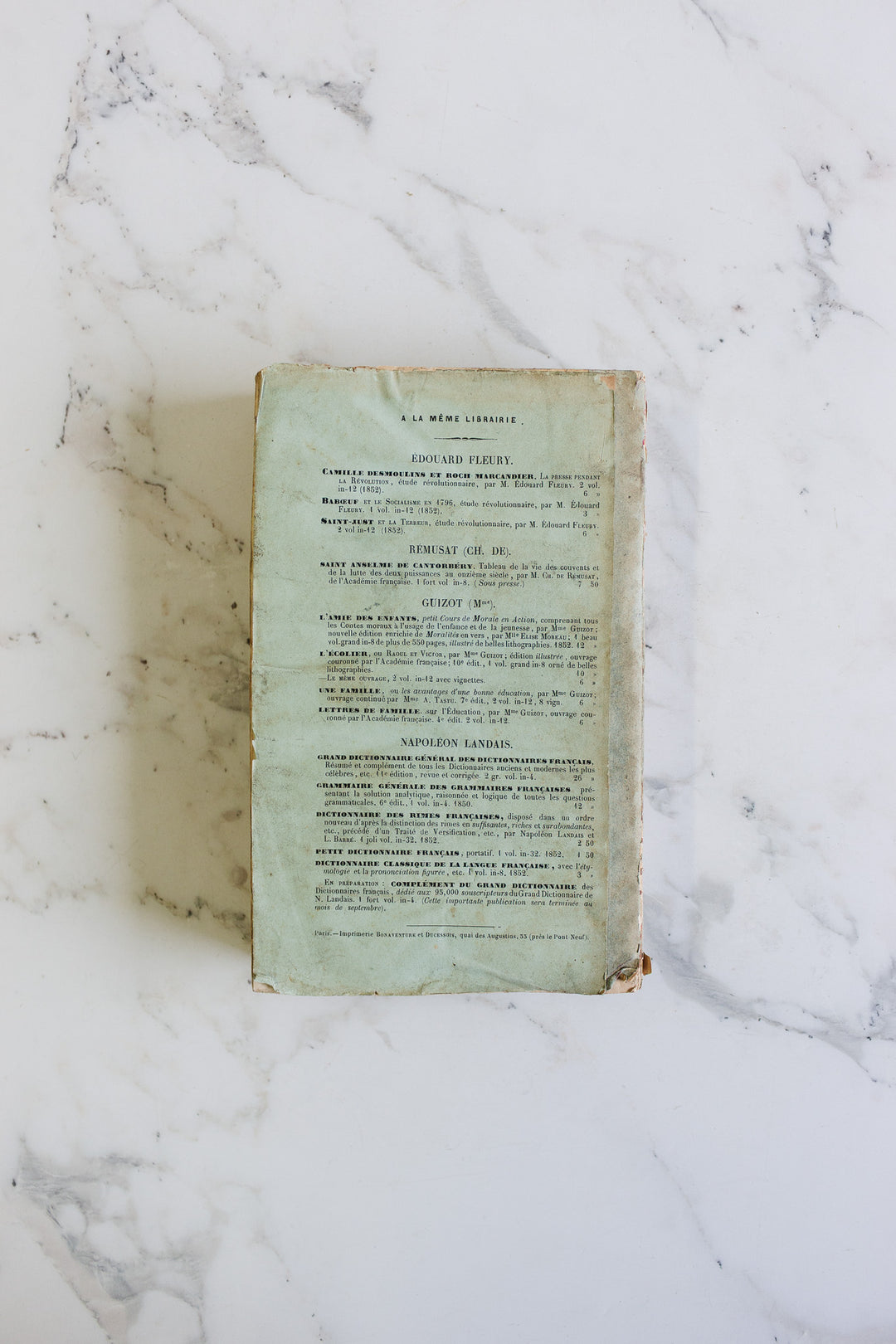 trio of antique french "fluffy page" books