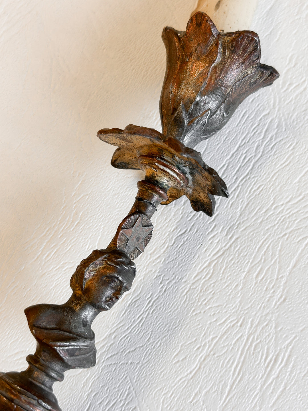antique cast metal figural candlestick pair