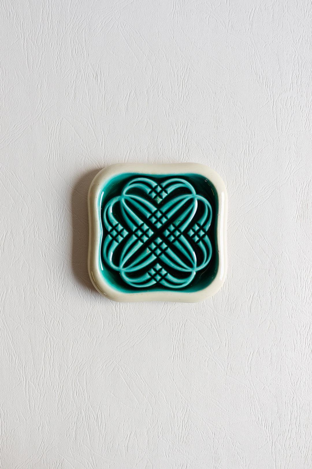 pair of art deco bottle coasters