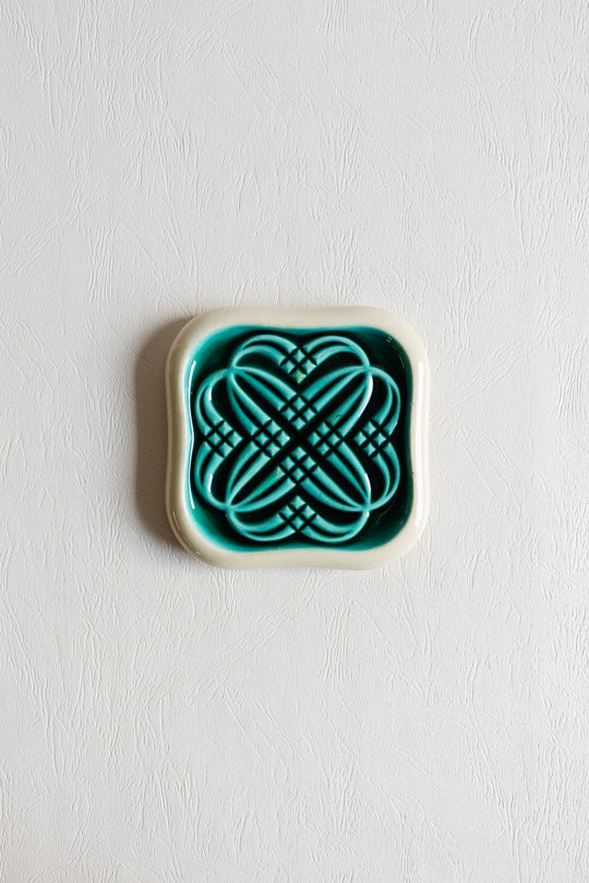 pair of art deco bottle coasters