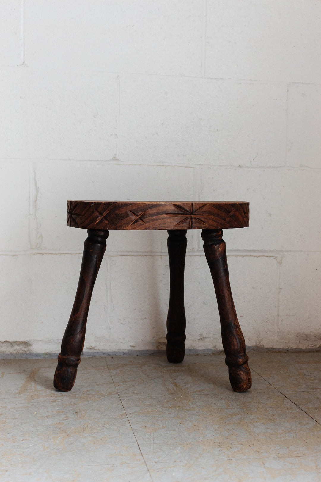vintage french brutalist tripod stool with starburst carving