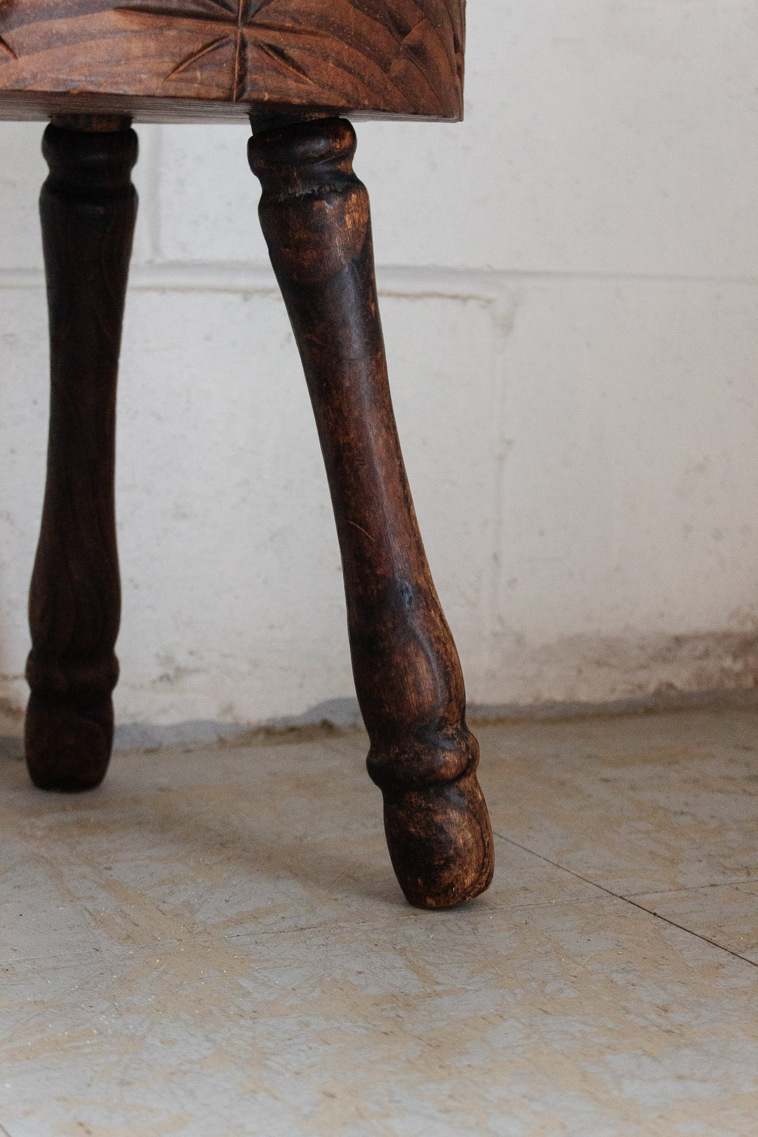 vintage french brutalist tripod stool with starburst carving
