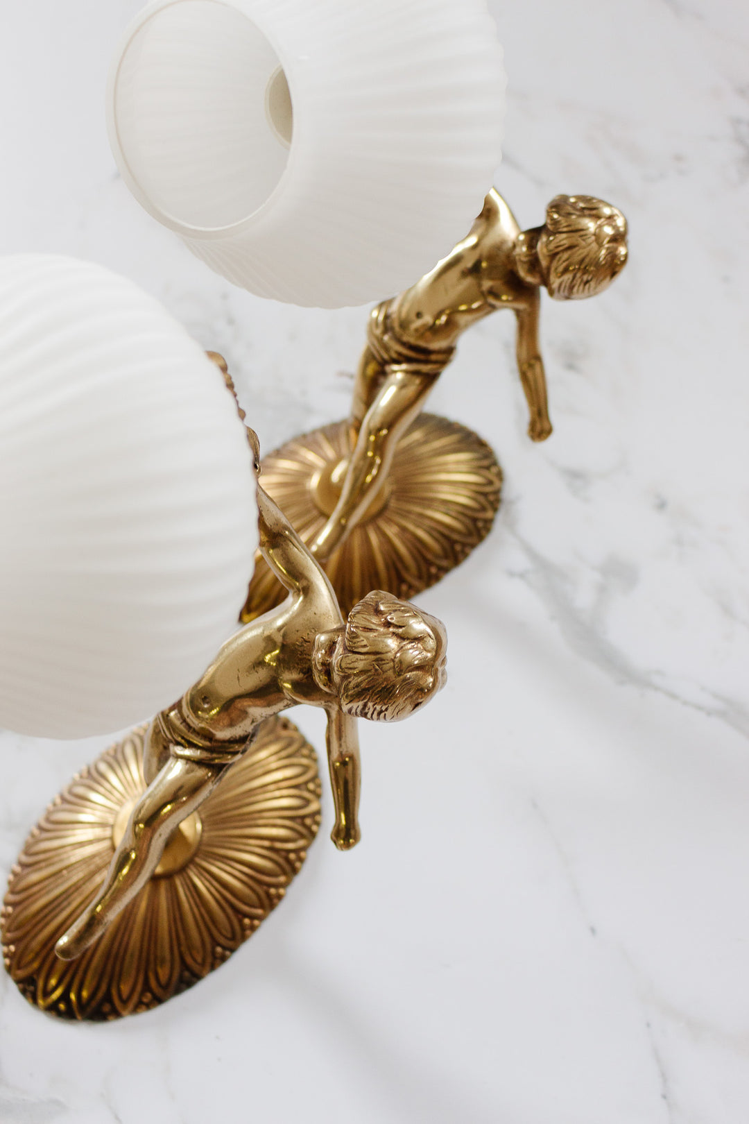 pair of turn of the century french putti angel sconces with glass glass shades