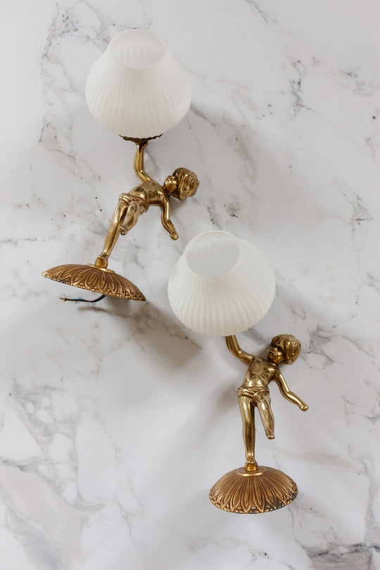 pair of turn of the century french putti angel sconces with glass glass shades