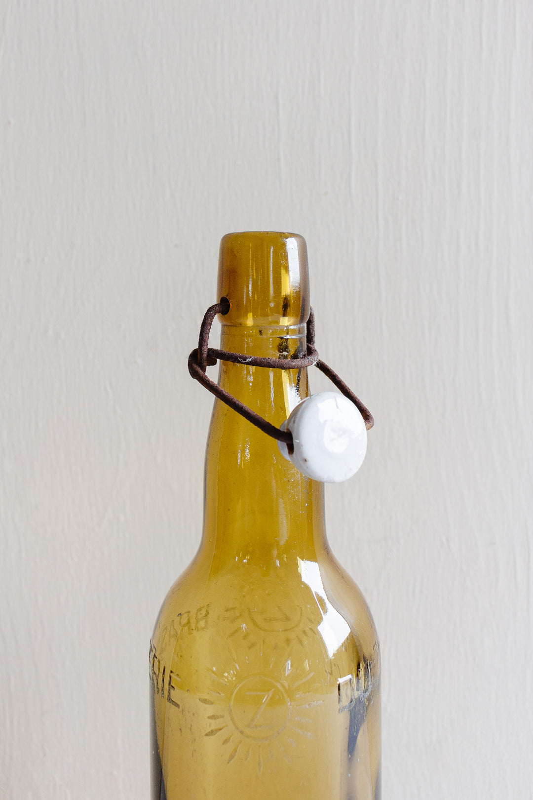 pair of vintage french amber brasserie bottles